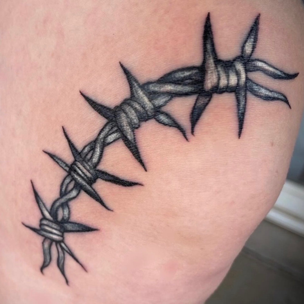 Black-and-grey barbed wire tattoo