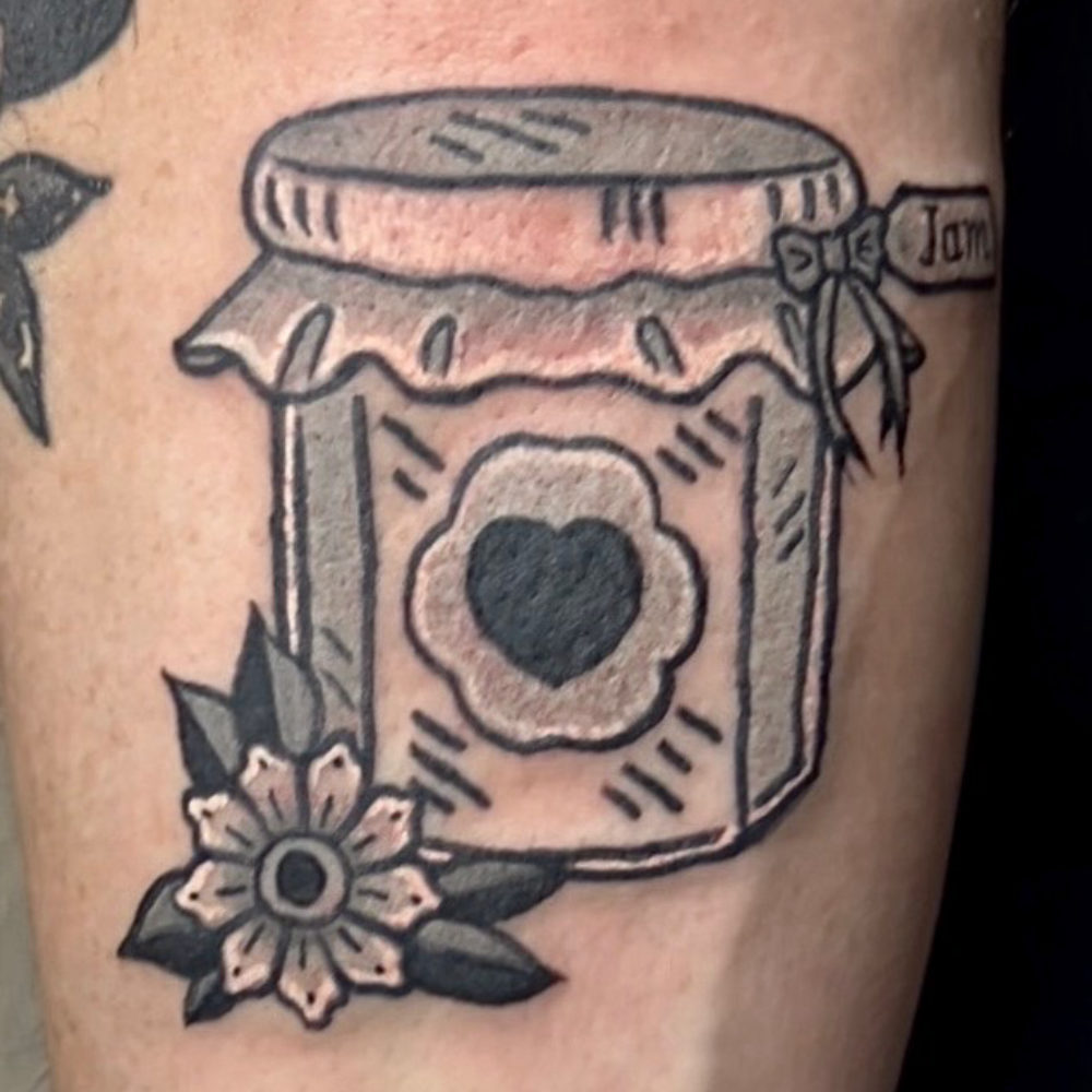 Traditional jam jar tattoo with heart and flower